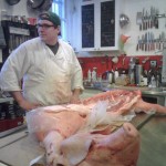 half a pig, with butcher